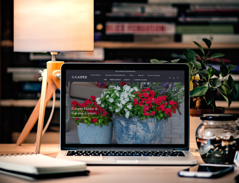 laptop image featuring garden center florals in a planter